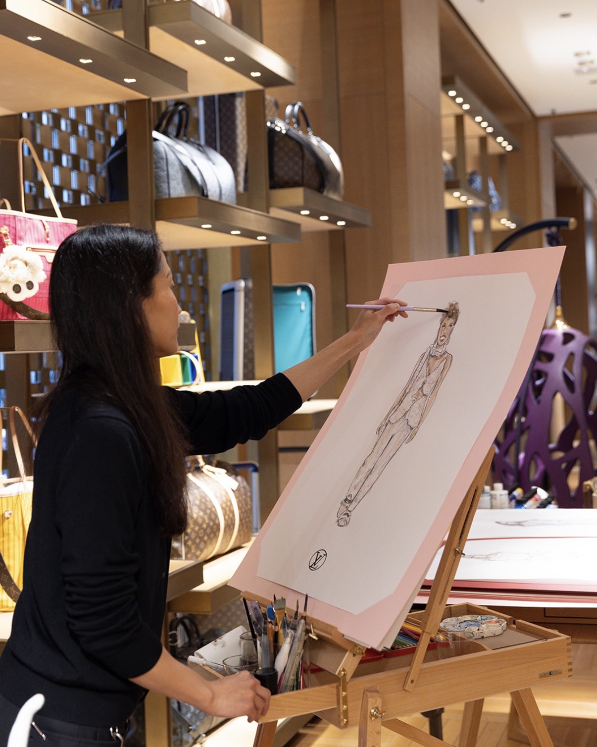 Live portrait artist sketching a guest at a luxury event